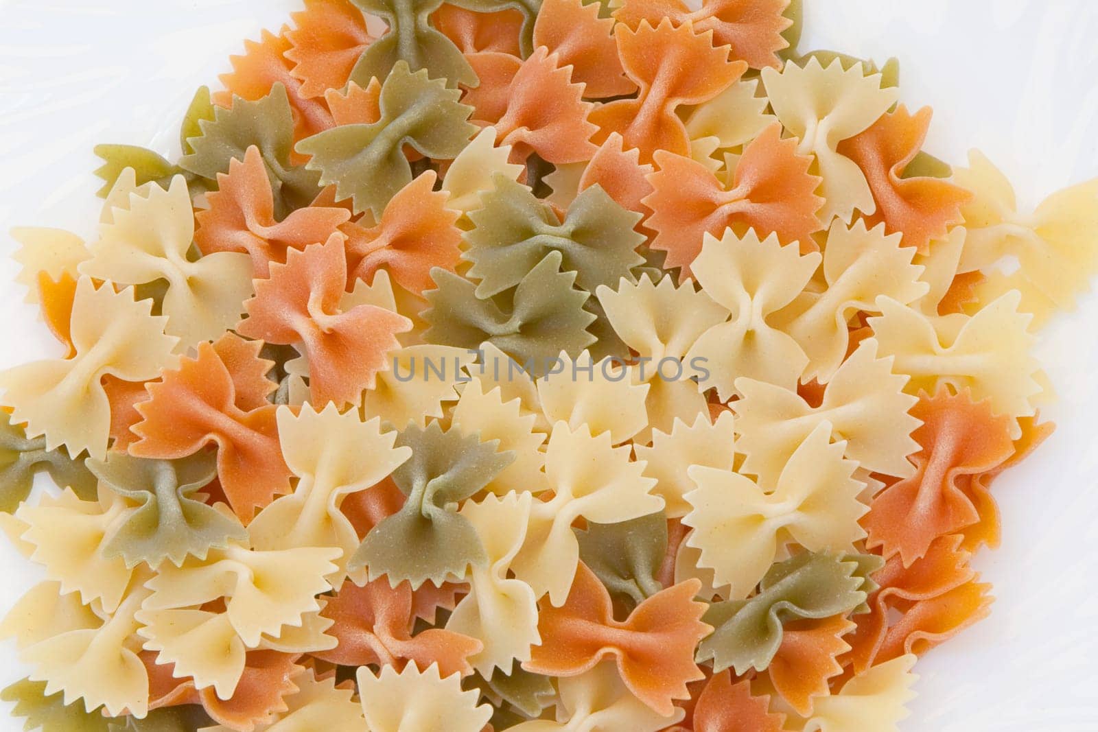 Many ties of colored pasta. Delicious carbohydrate