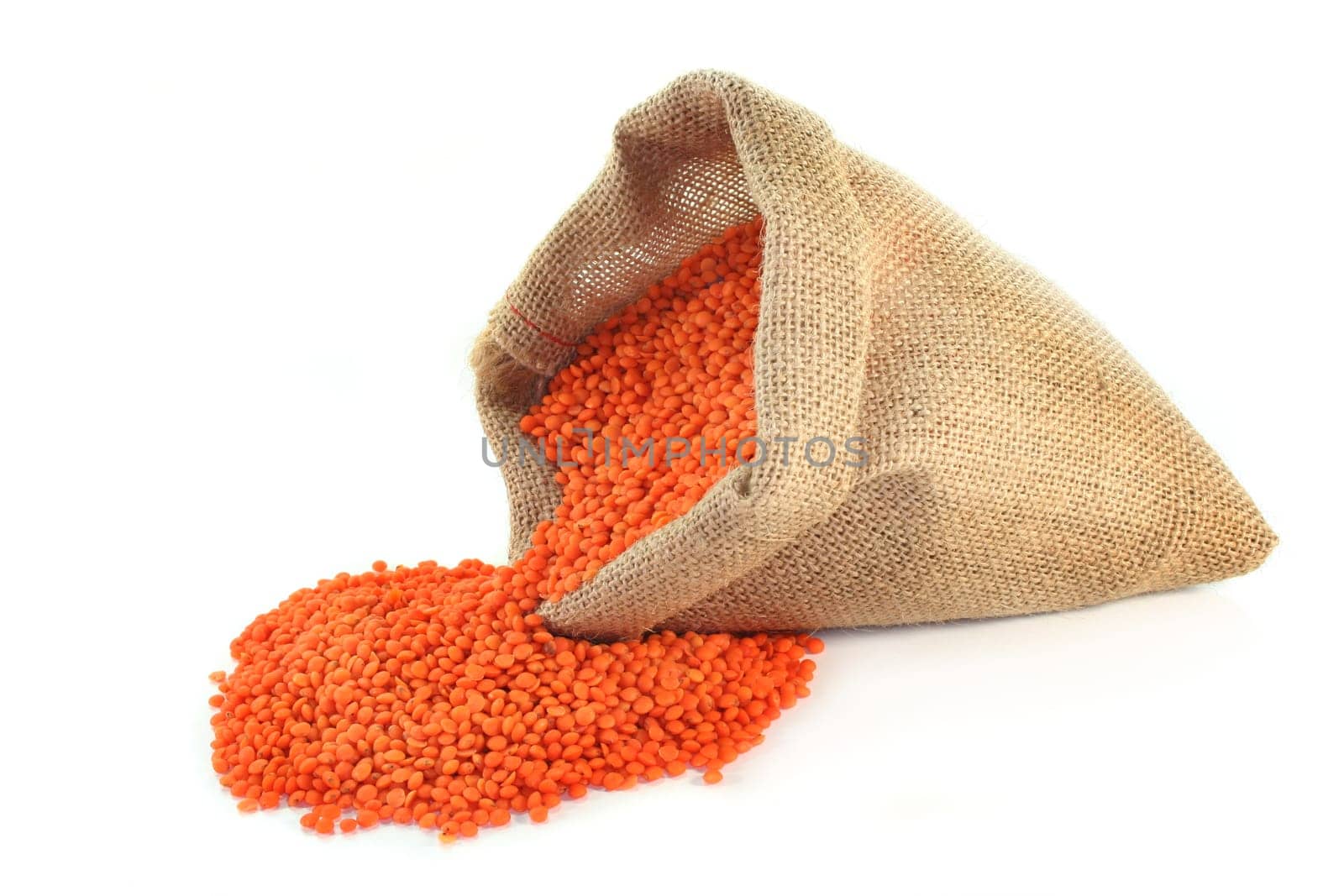 dried red lentils in a jute bag