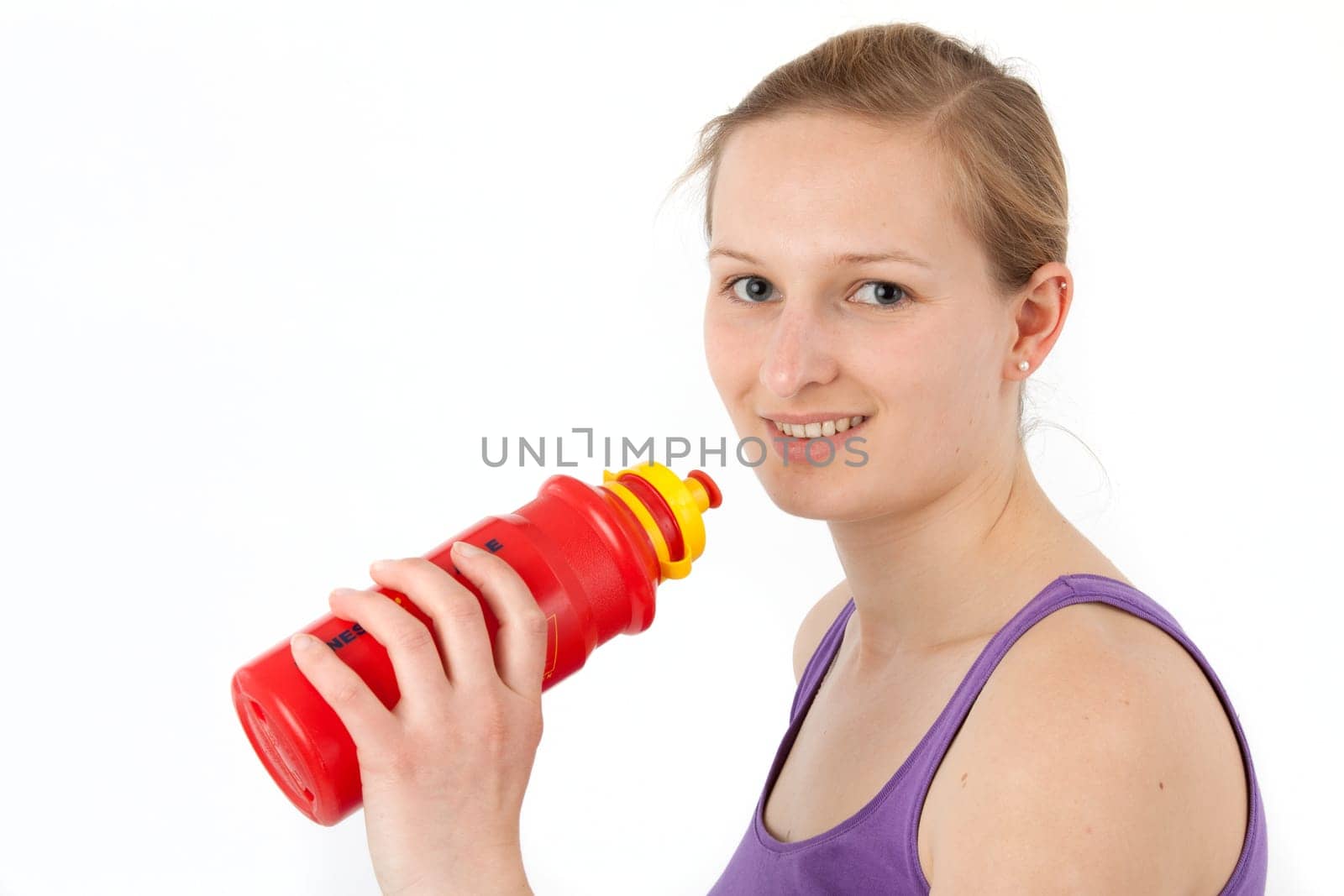 Young woman drinking from a drinking bottle