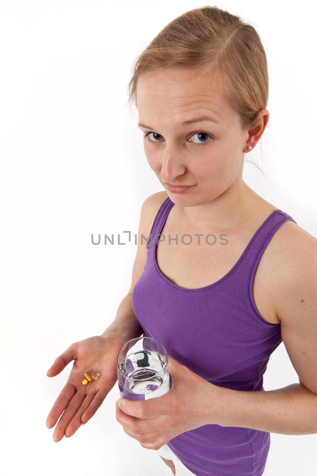 Young woman taking pills