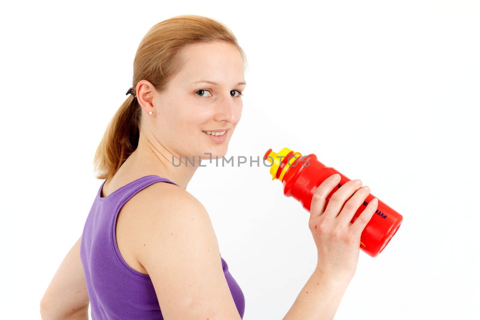Young woman drinking from a drinking bottle