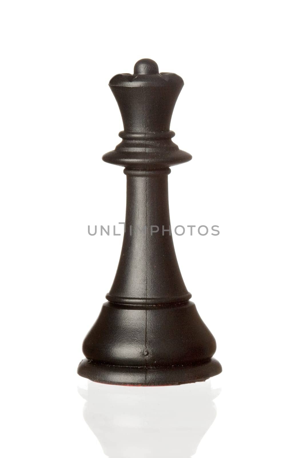 Black queen chess piece isolated on white background with reflection on the floor
