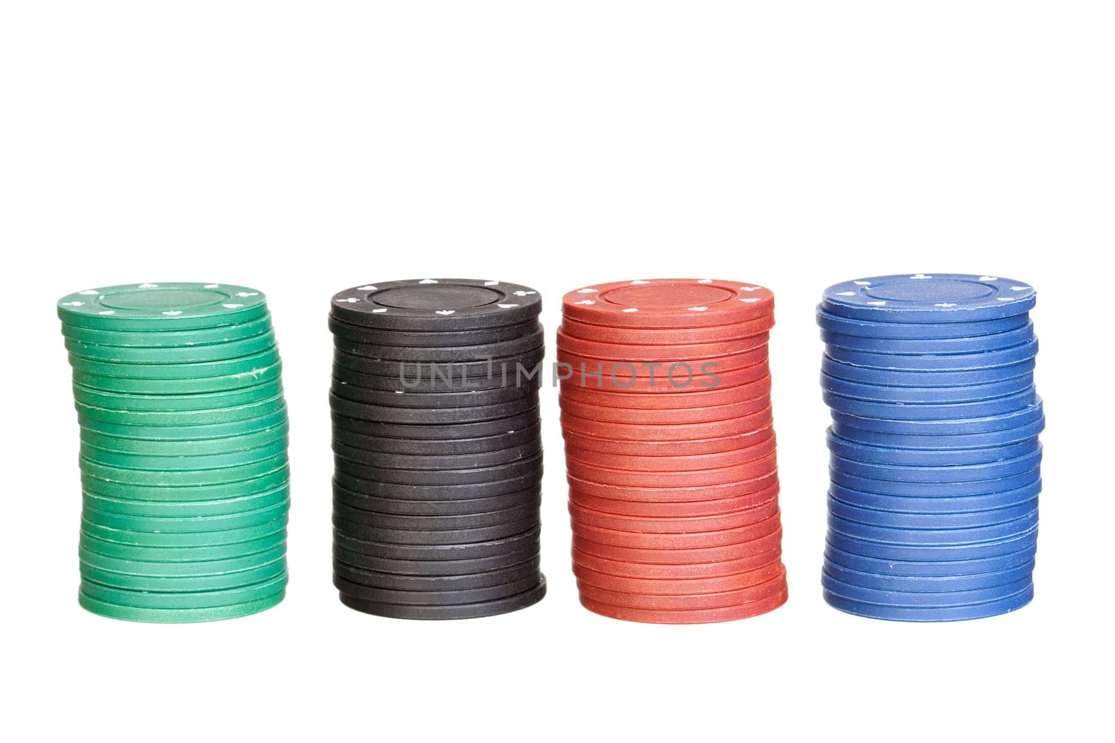 Poker chips of four different colors isolated ona a over white background