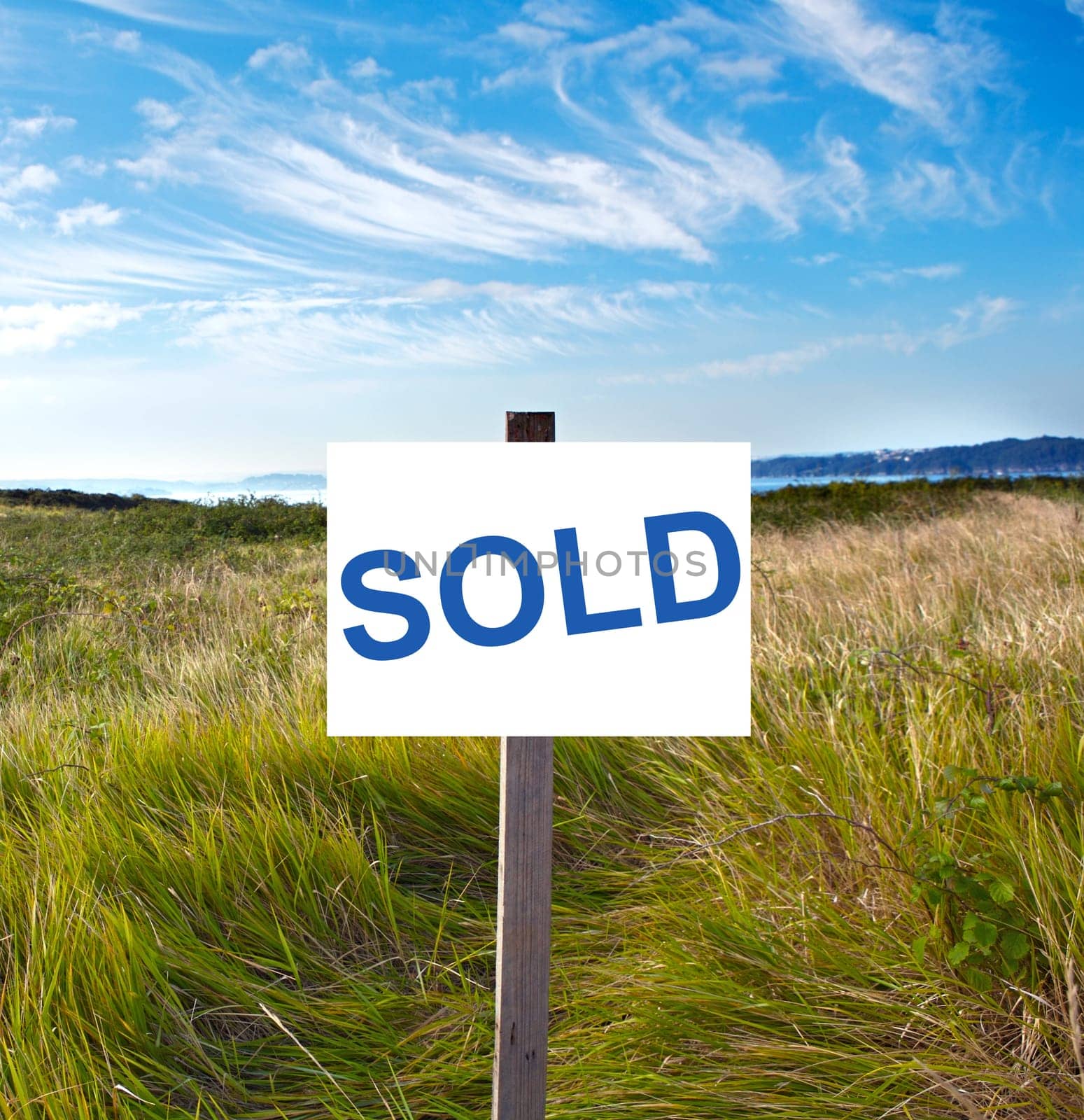 Blank billboard with message "sold"" in the field"