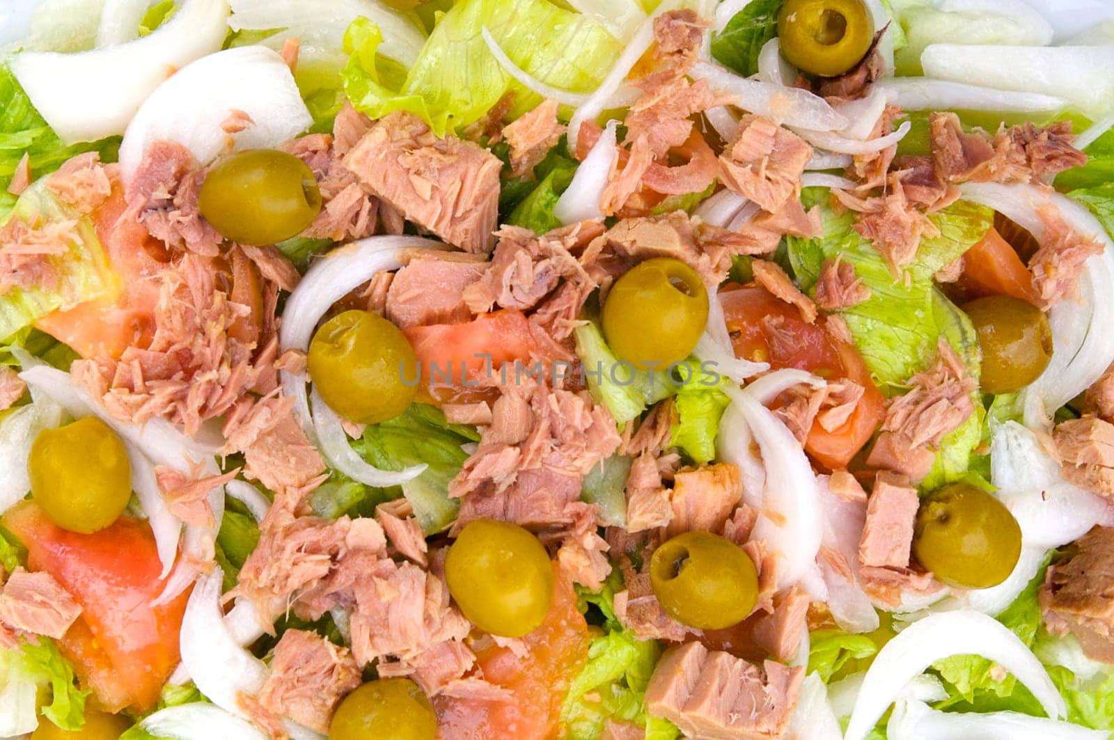 Delicious salad of tomato, lettuce and olives