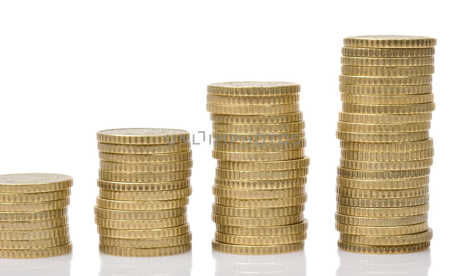 Four piles of money isolated on white