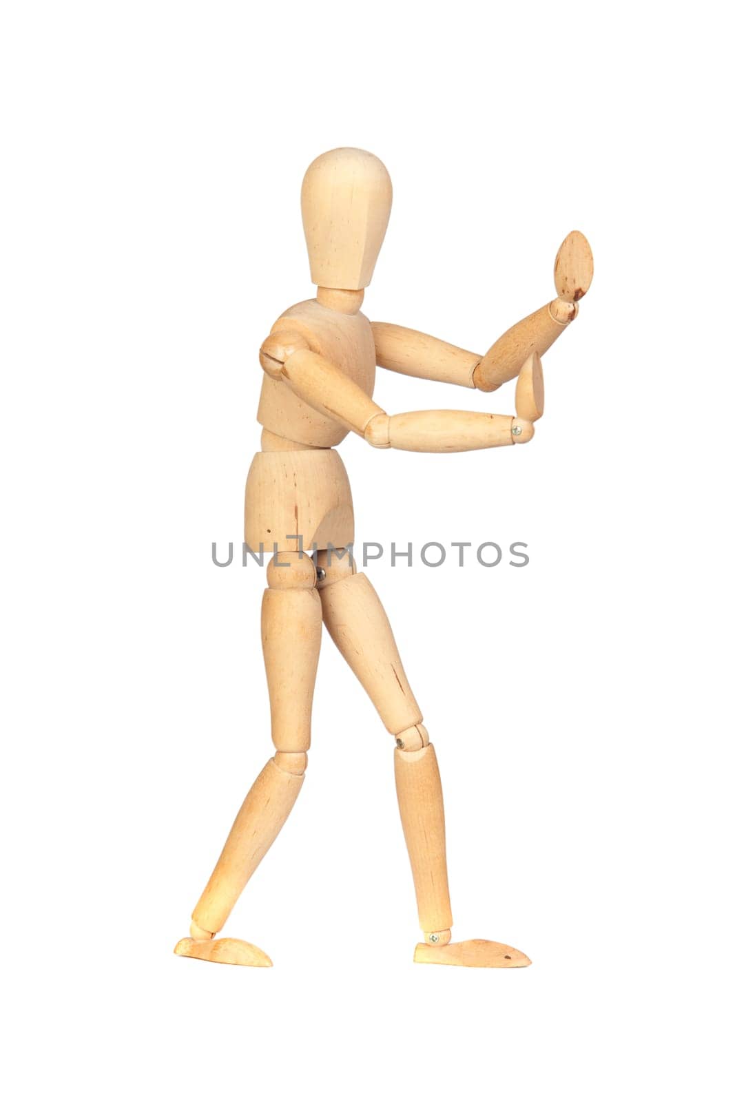 Jointed wooden mannequin pushing something isolated on white background