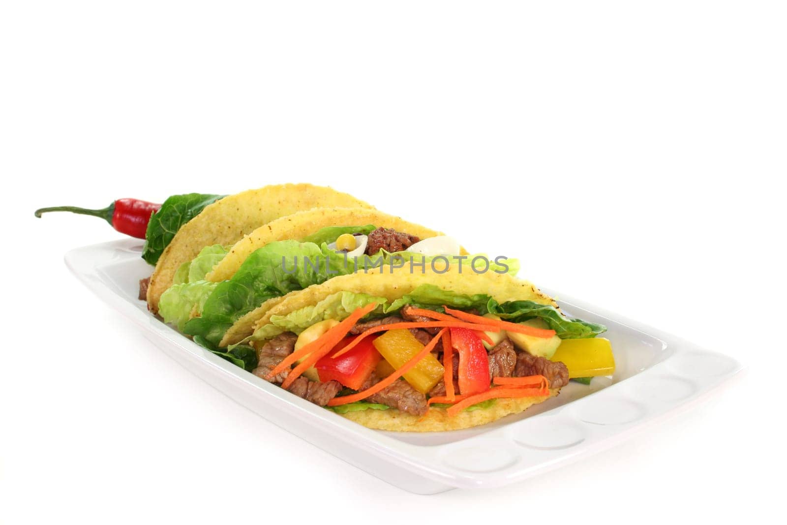 Taco shells filled with beef fillet strips and vegetables