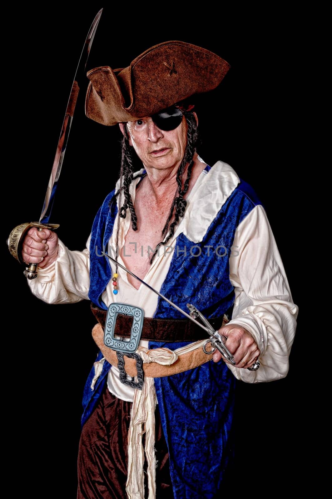 Pirate isolated on black with a cutlass