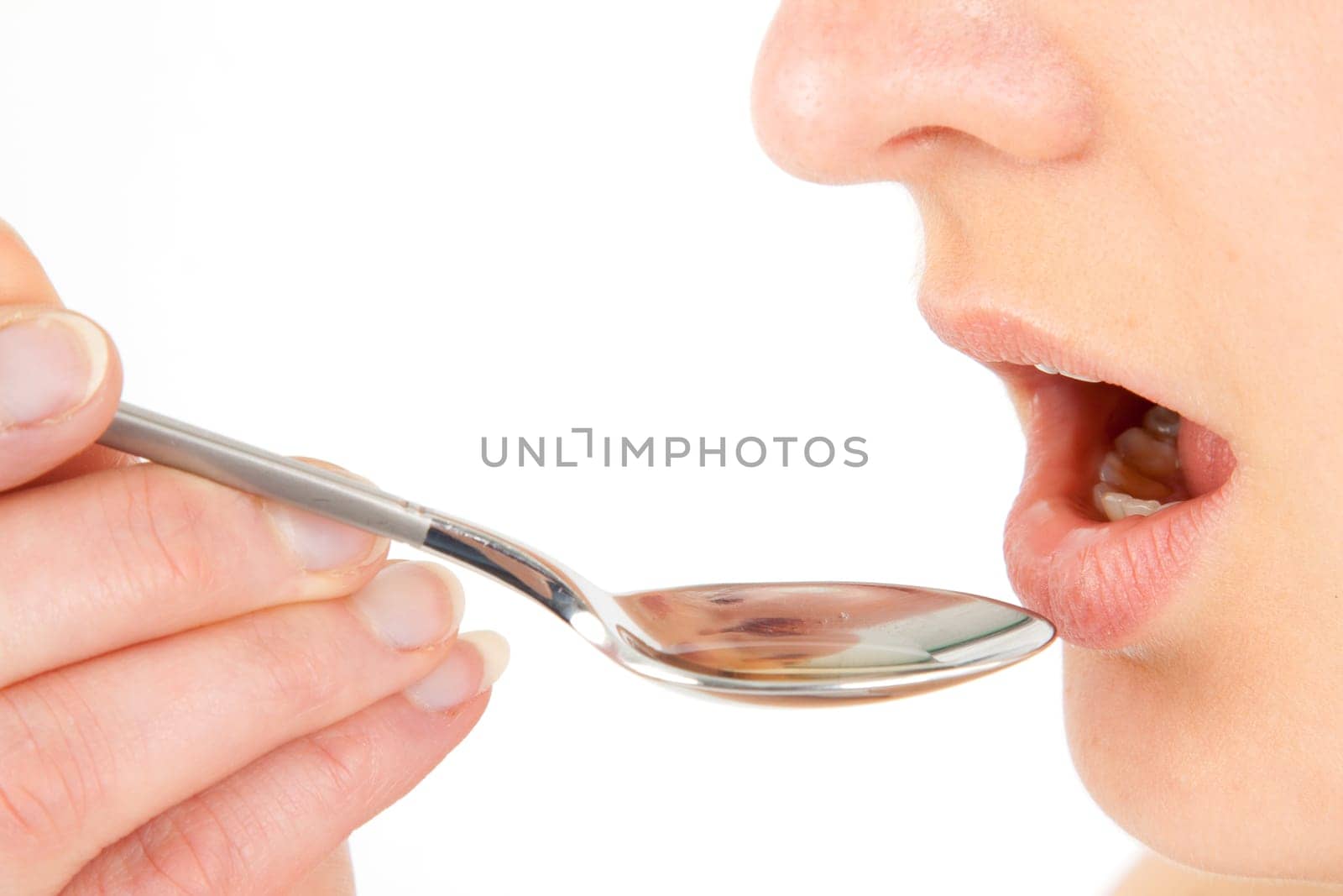 Woman taking medical drops