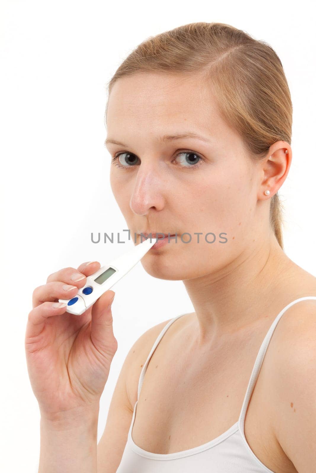 Young woman measuring fever