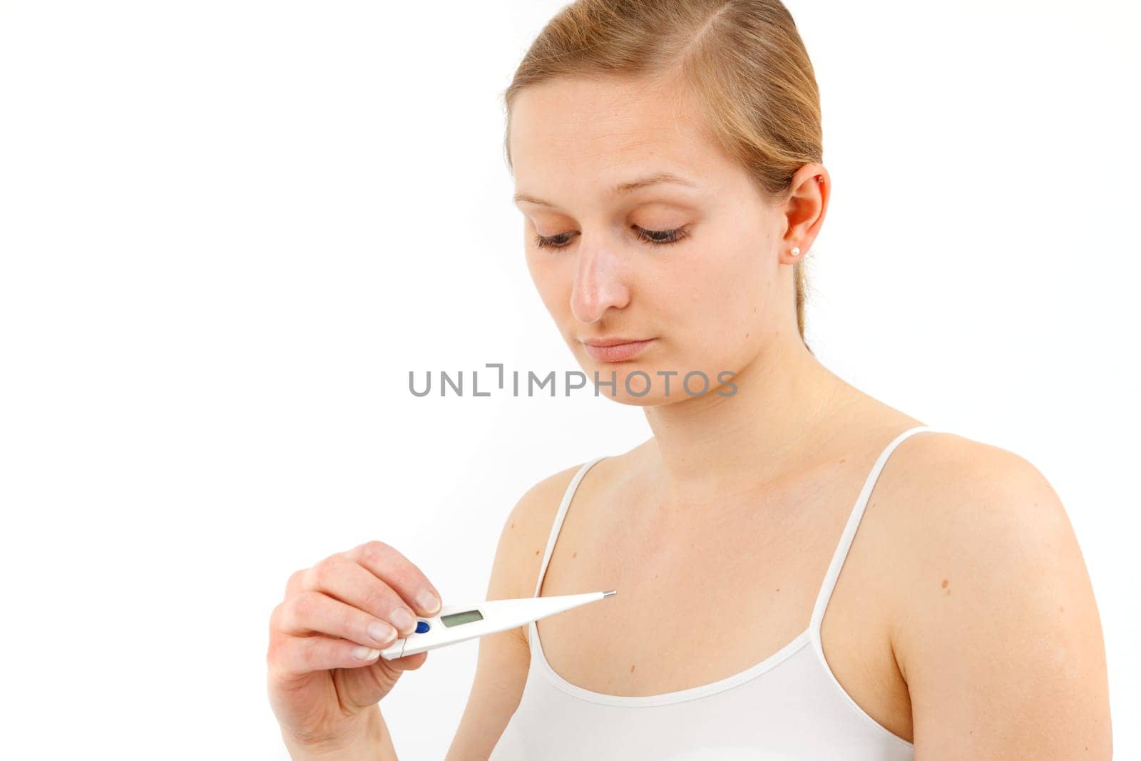 Young woman measuring fever