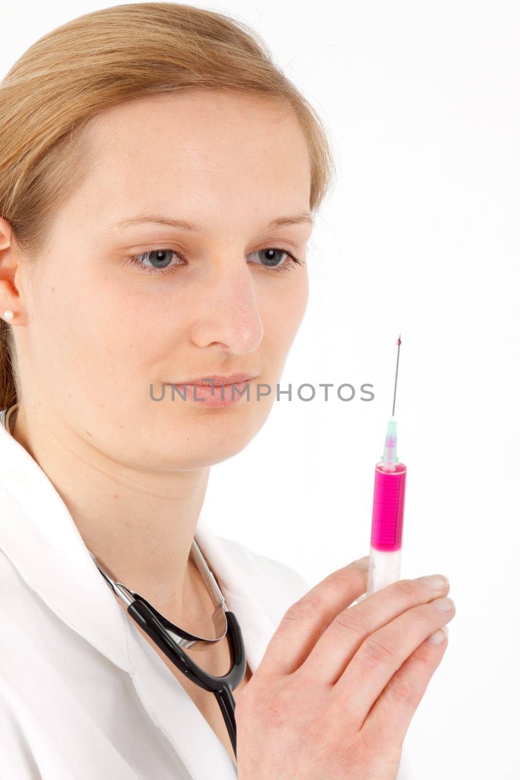 Young female doctor or nurse giving injection