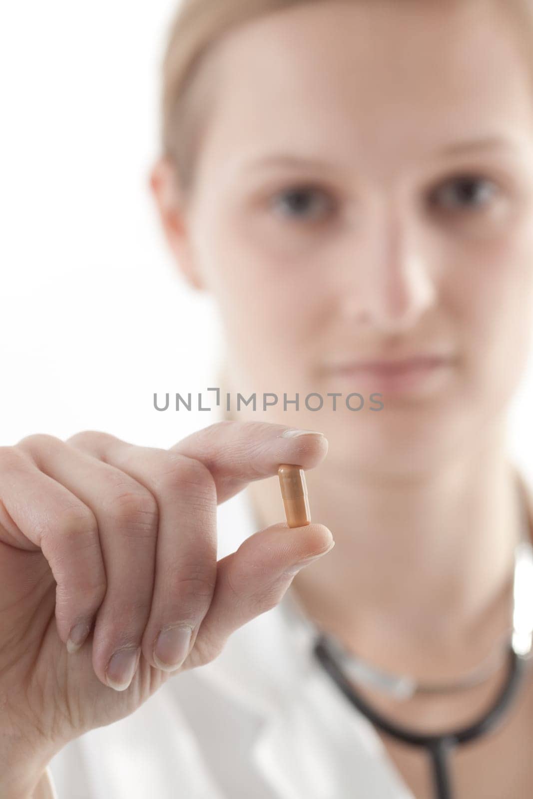 Female doctor or nurse with tablets