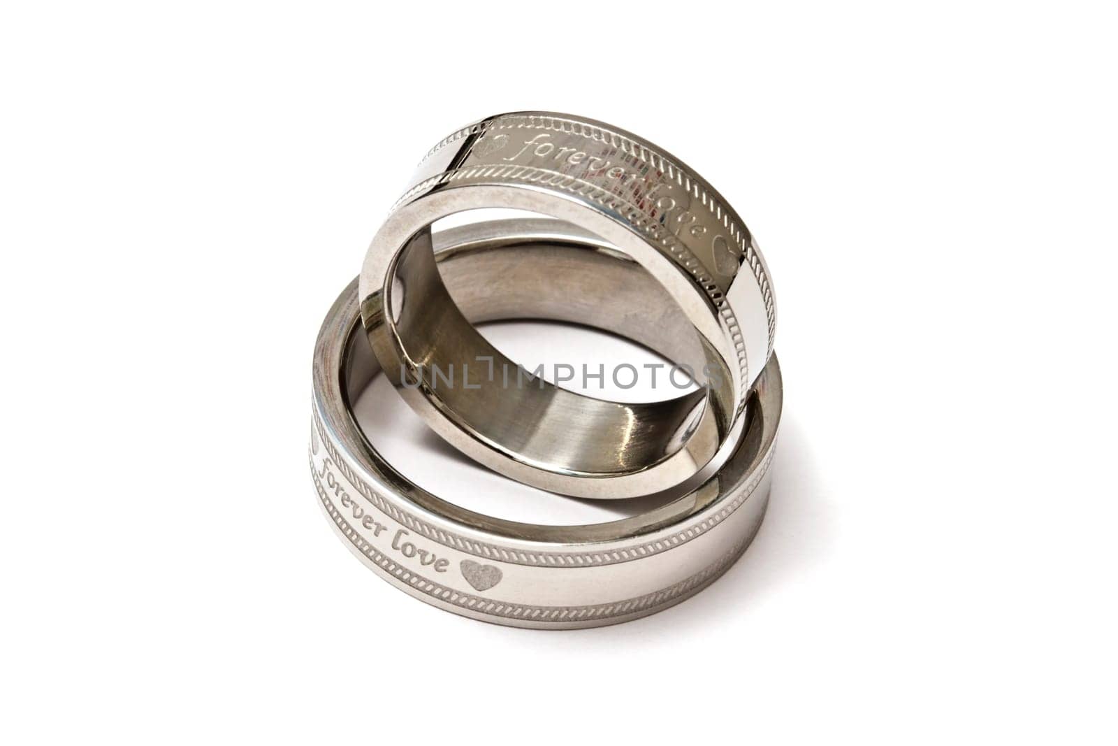 Wedding rings of Forever Love isolated on white background