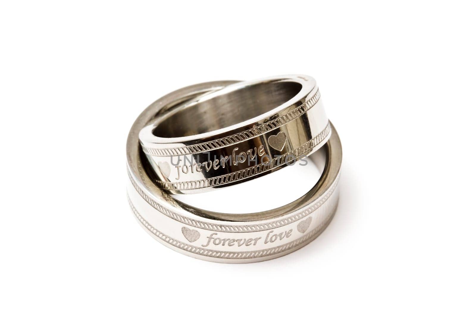 Wedding rings of Forever Love isolated on white background