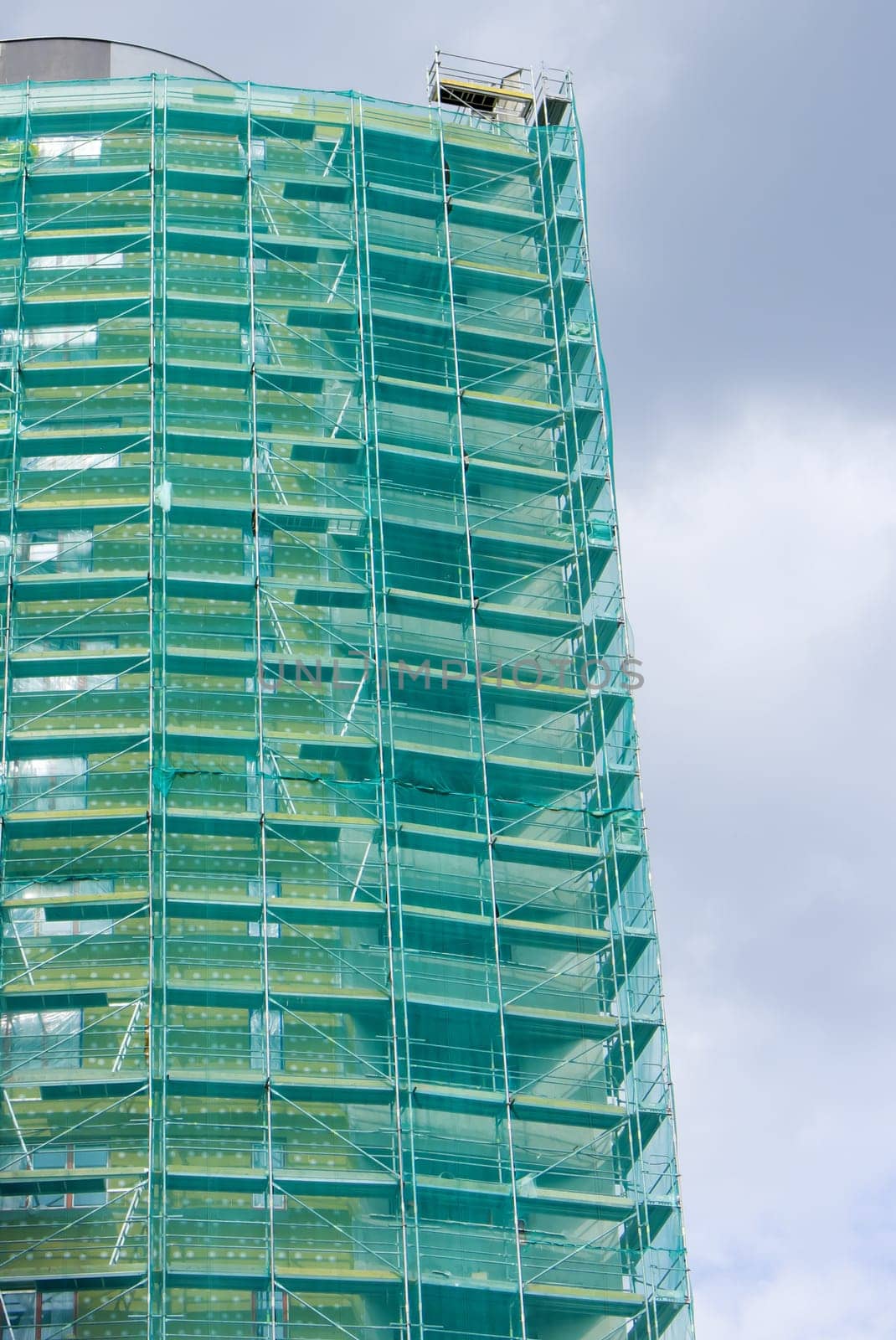 Modern Building Under Construction With Scaffolding
