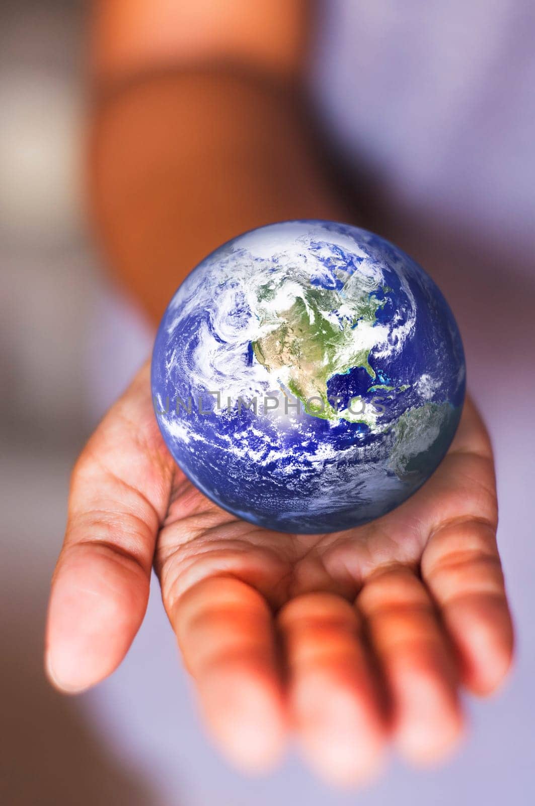 image composite of earth on palm, for conceptual usage.