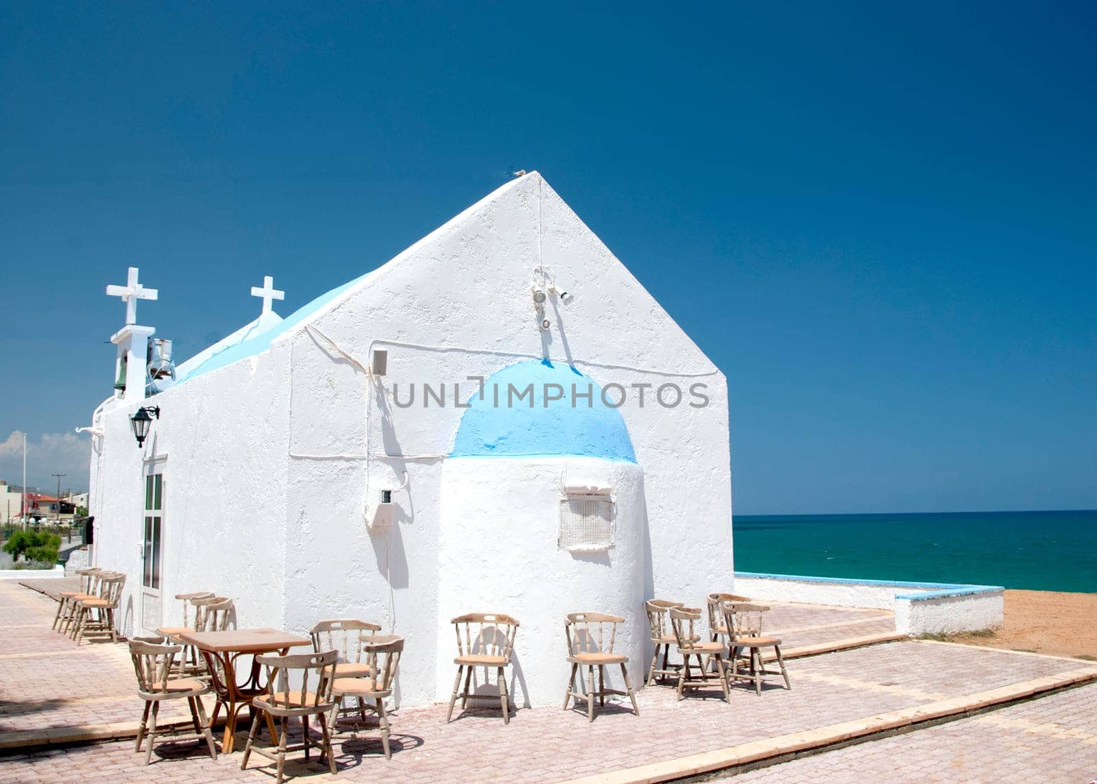 A Pretty Greek Orthodox Church on a headland in Crete Popular for outdoor weddings