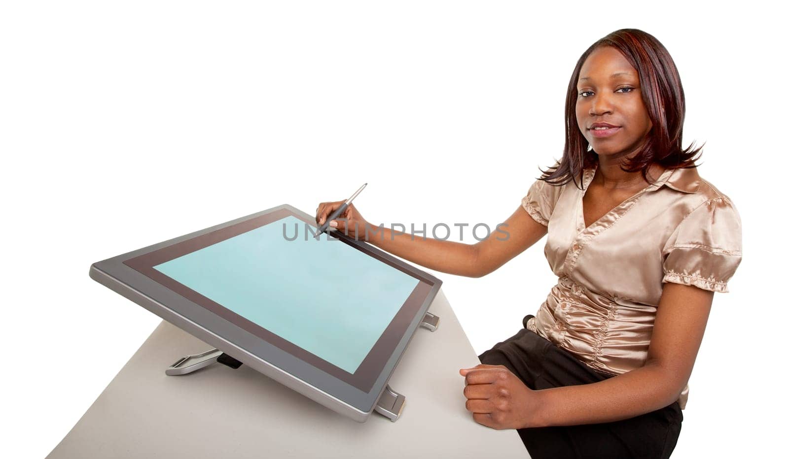 An African American Woman is working on a digital tablet.