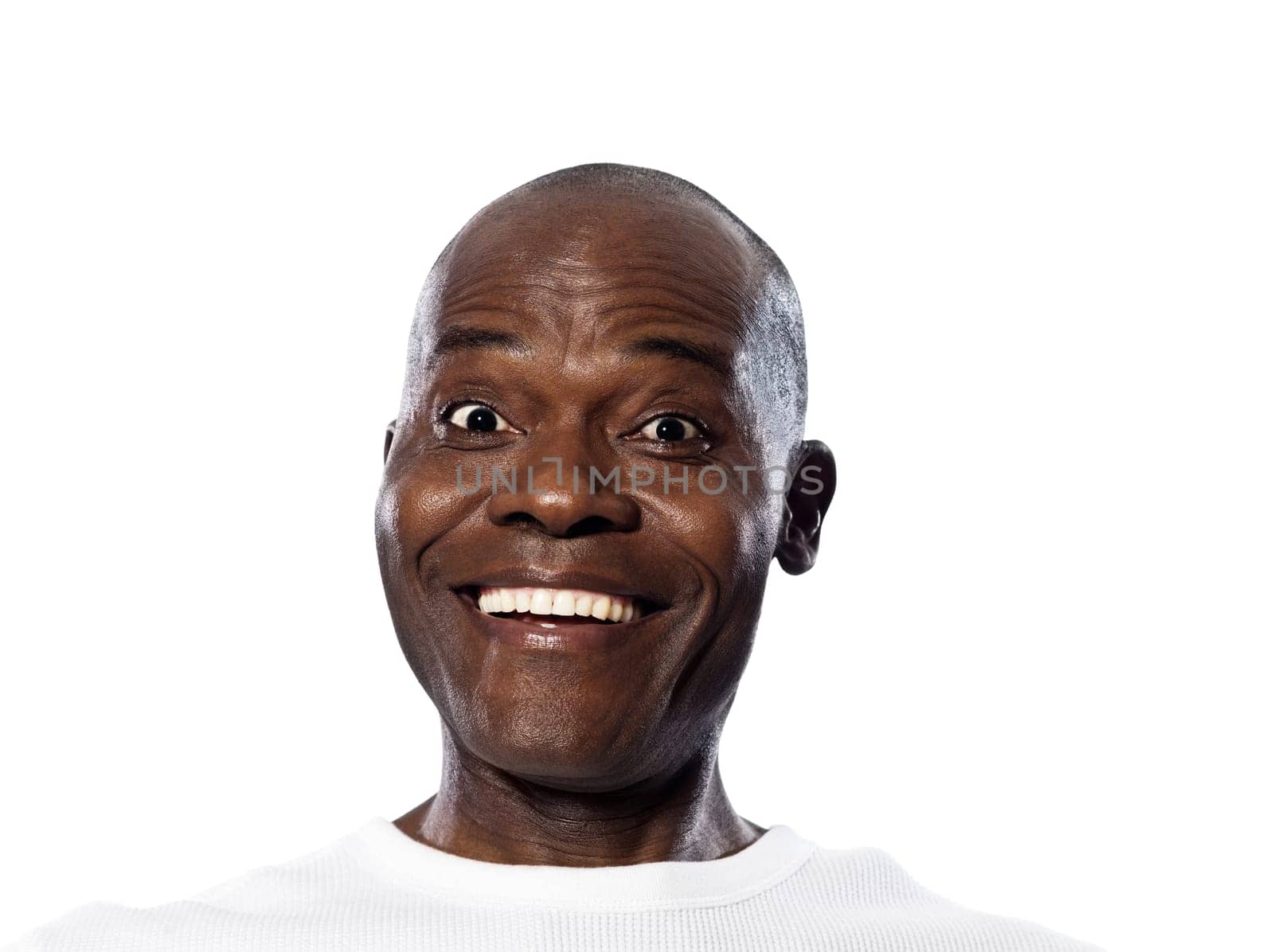 Portrait of an expressive Afro American man smiling with eyes wide open in studio on white isolated background
