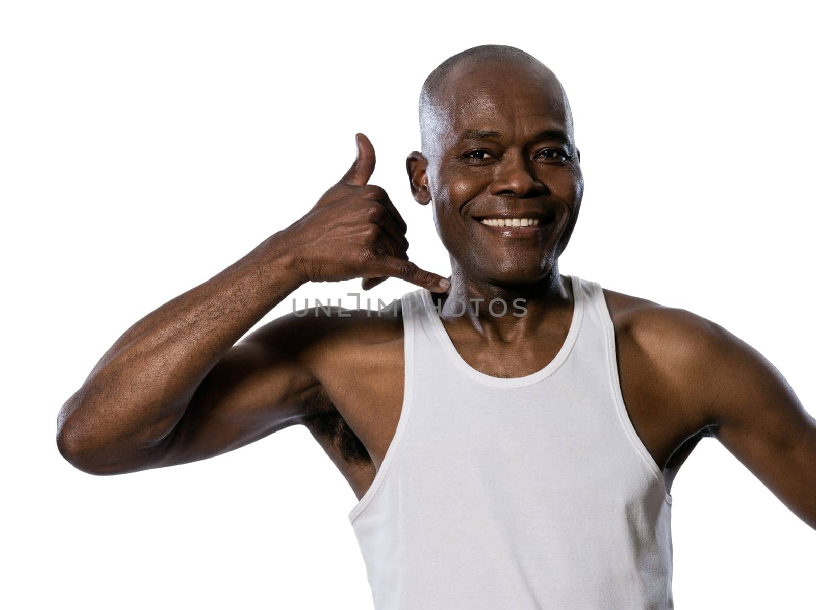 Portrait of a friendly afro American man showing call me gesture in studio on white isolated background