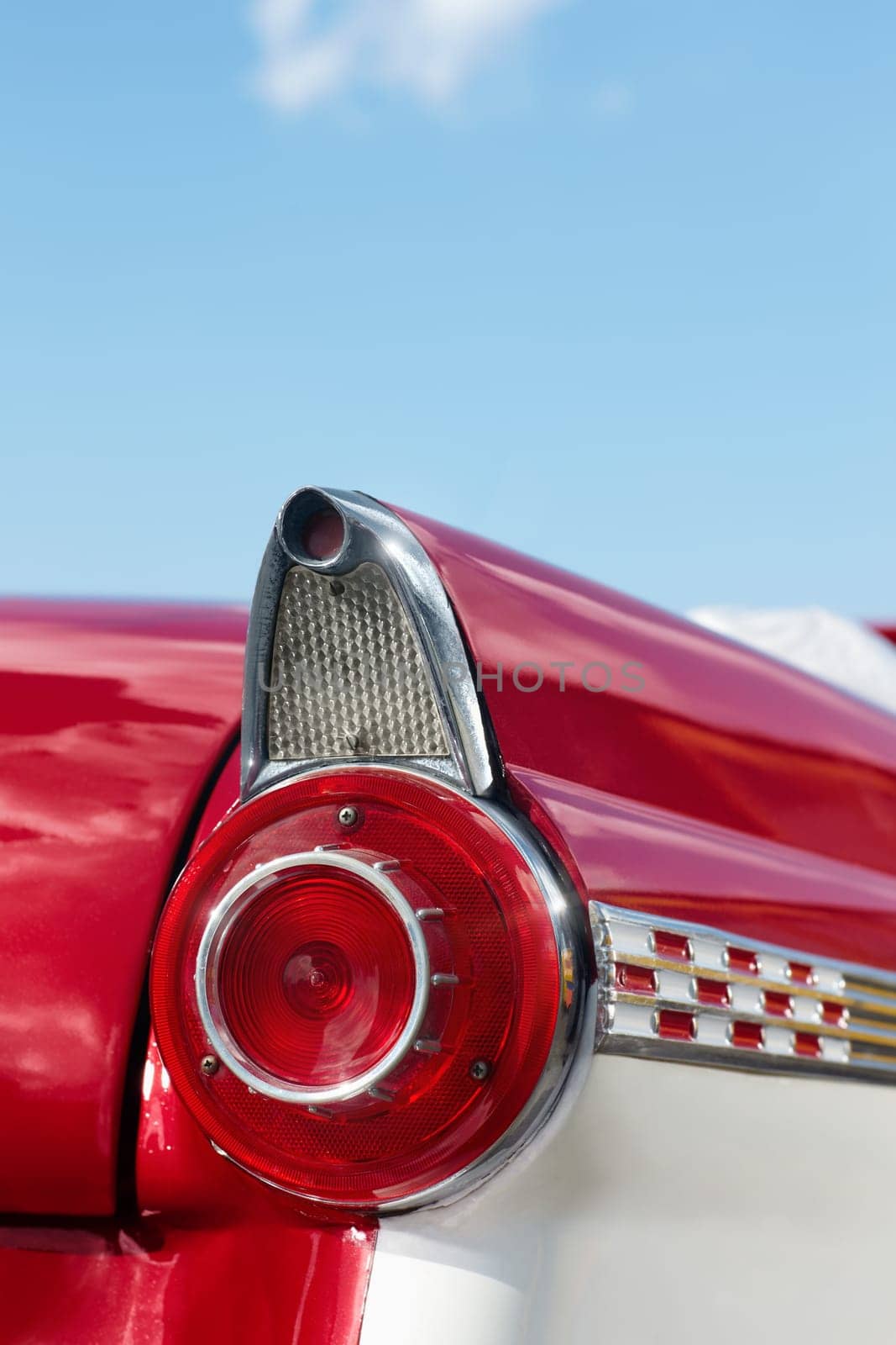 close up of 1960s red convertible car in Cuba. Vertical shape, copy space