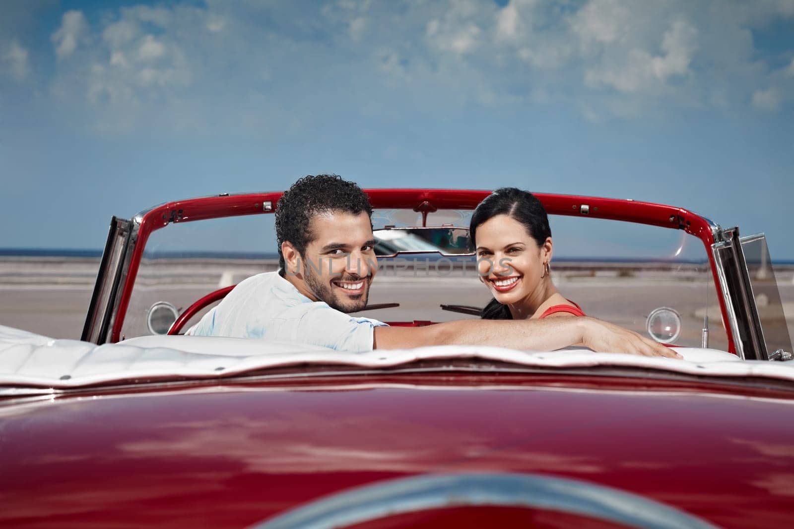 boyfriend and girlfriend sitting in vintage car and hugging in havana, cuba. Horizontal shape, side view, copy space