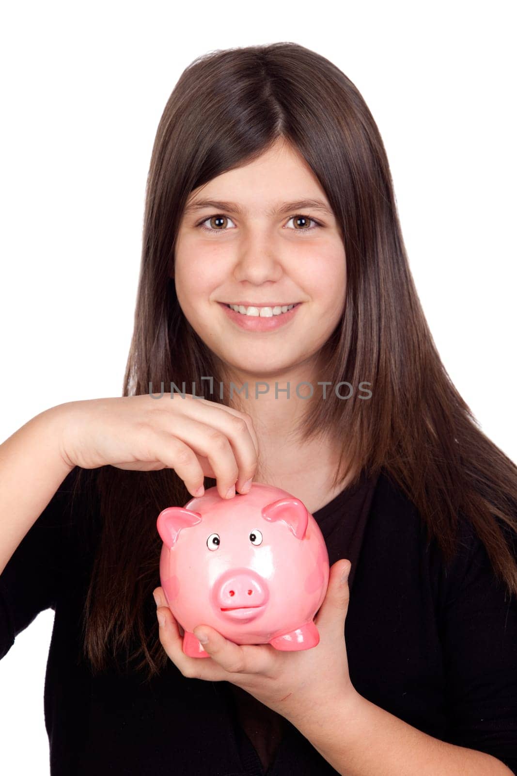 Adorable preteen girl with a piggy-bank isolated on white background