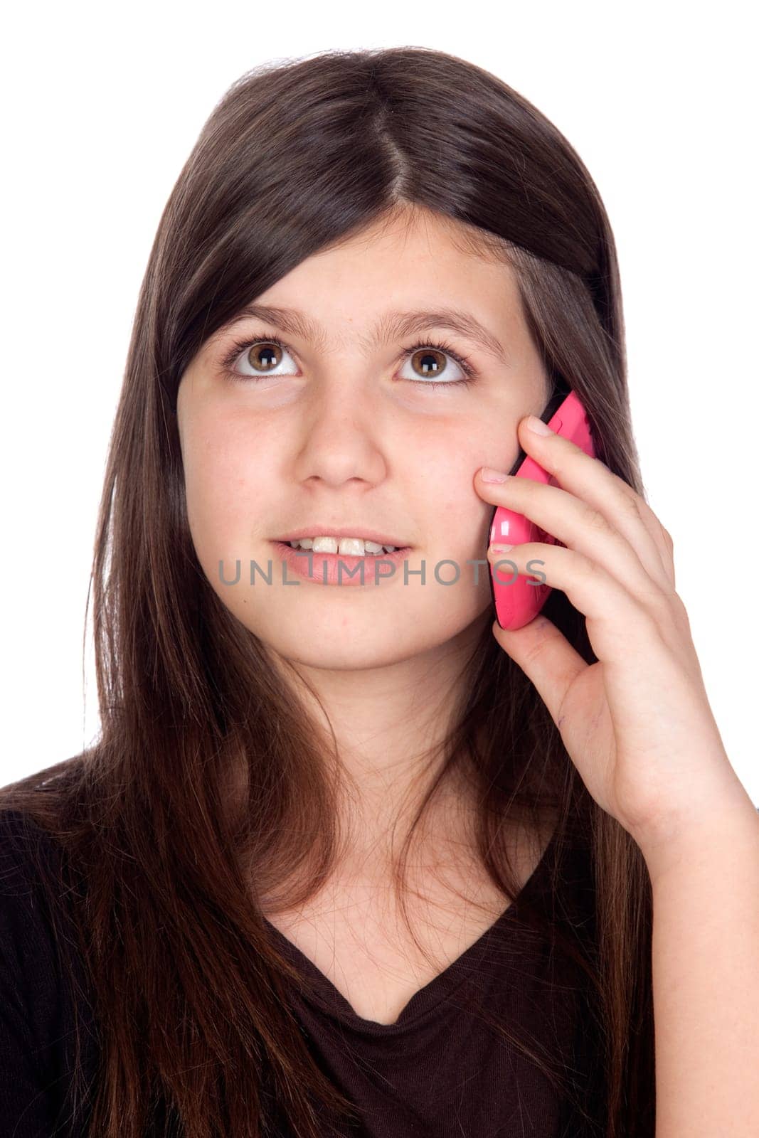 Adorable preteen girl with a mobile isolated on white background