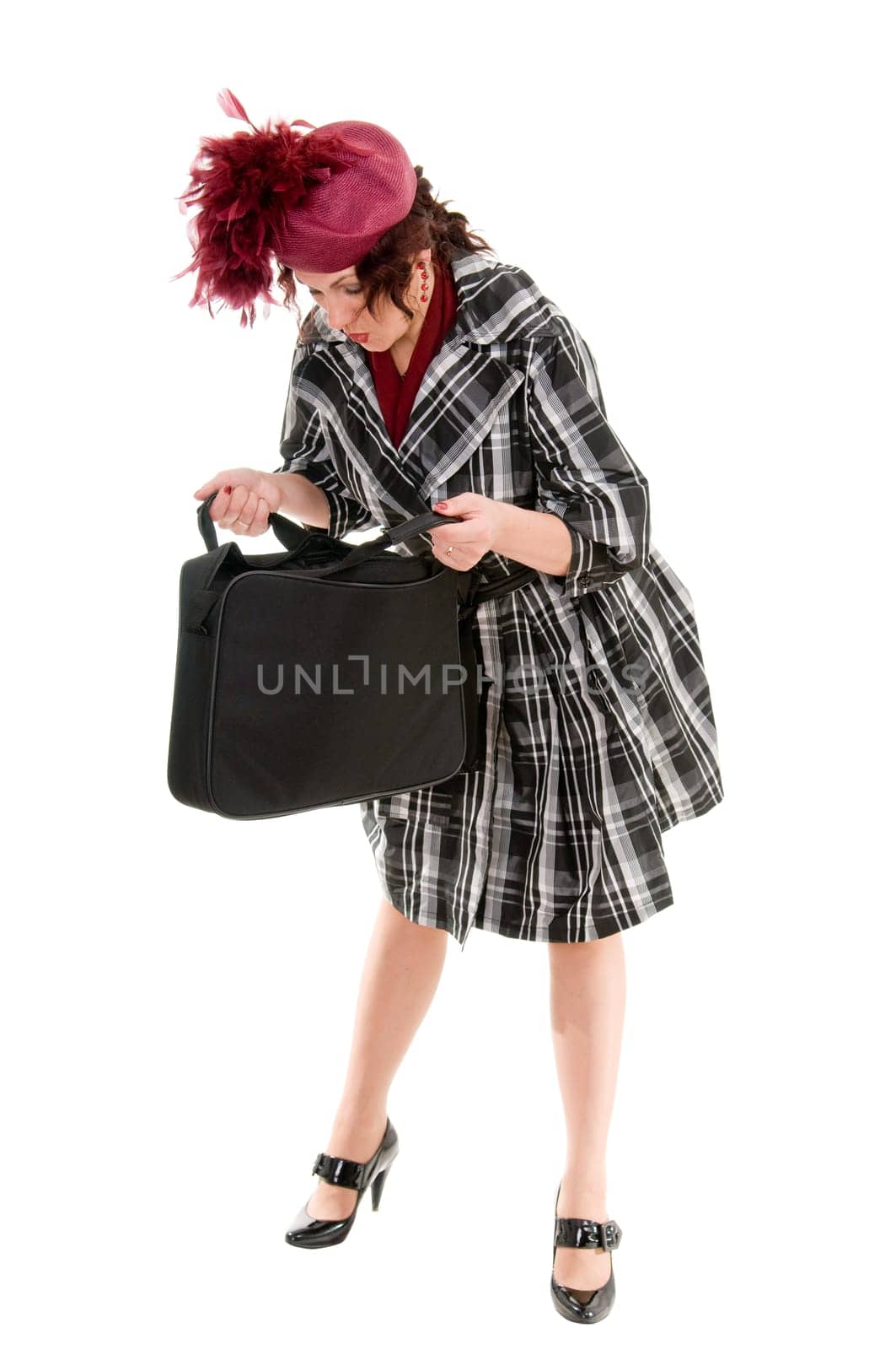 The woman with a bag in a ladies&#039  hat isolated on white background