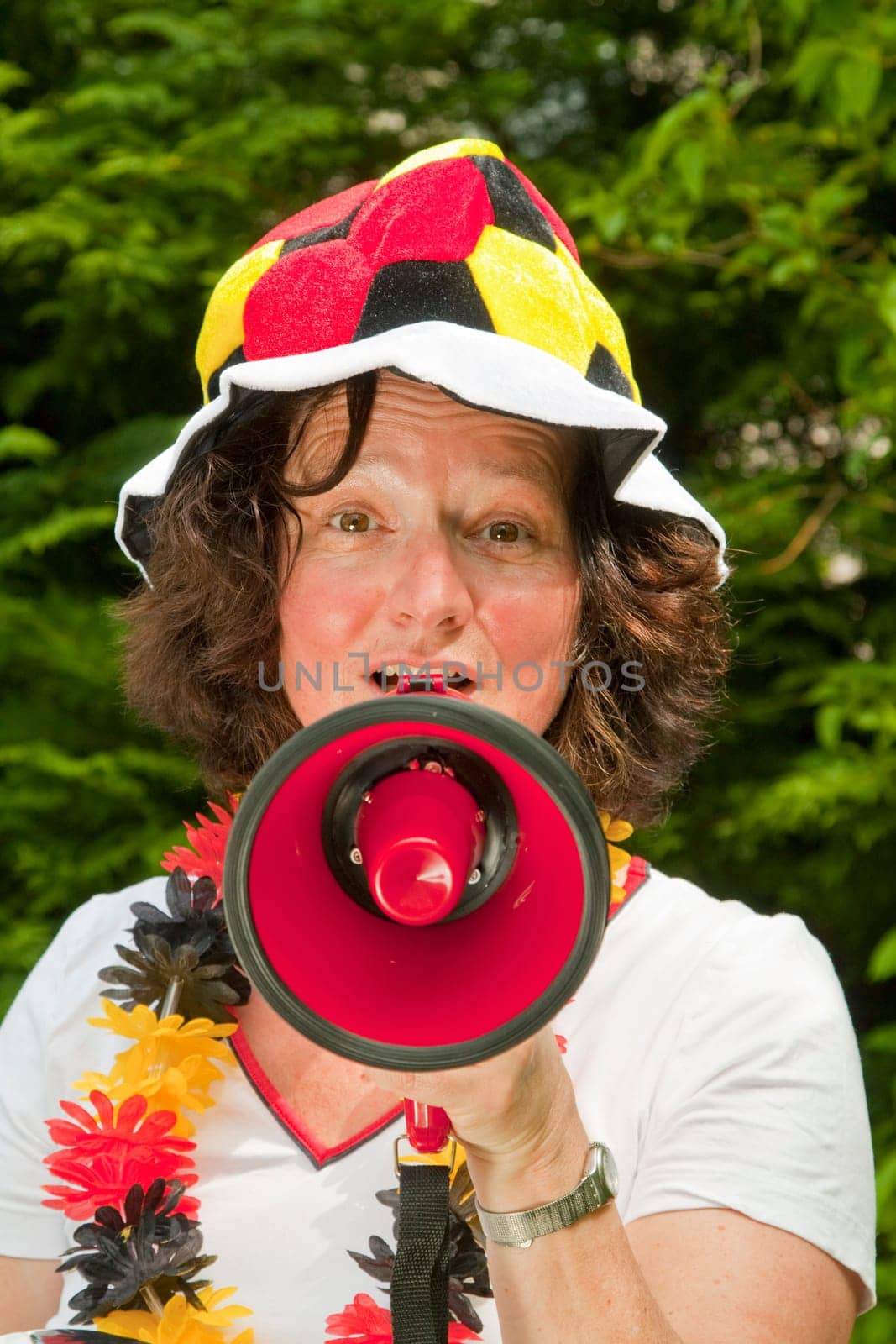 Female football fan with hat and Germany flag
