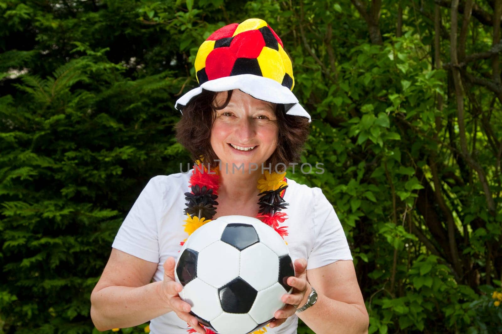 Female football fan with hat and Germany flag