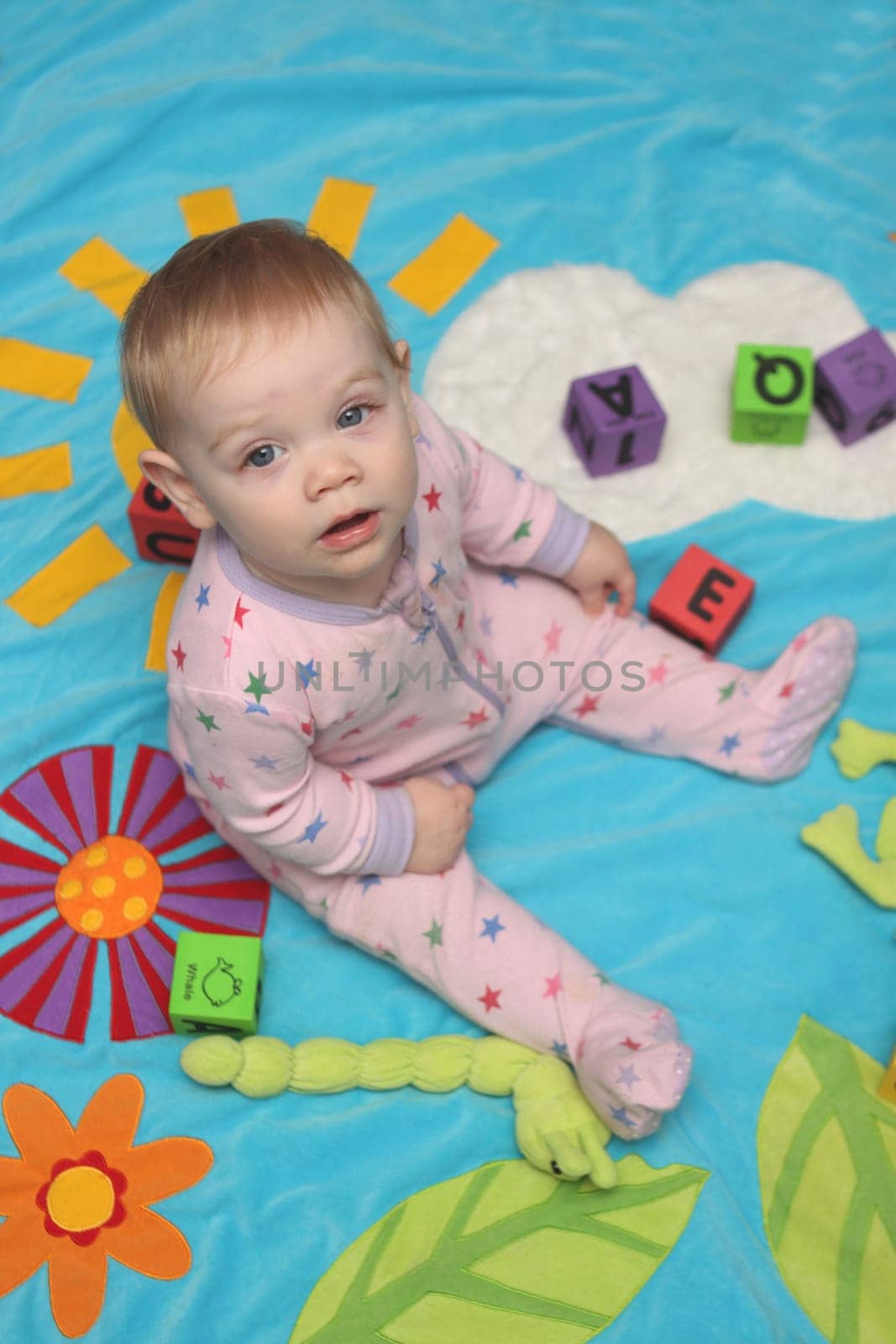 A small baby girl playing by herself
