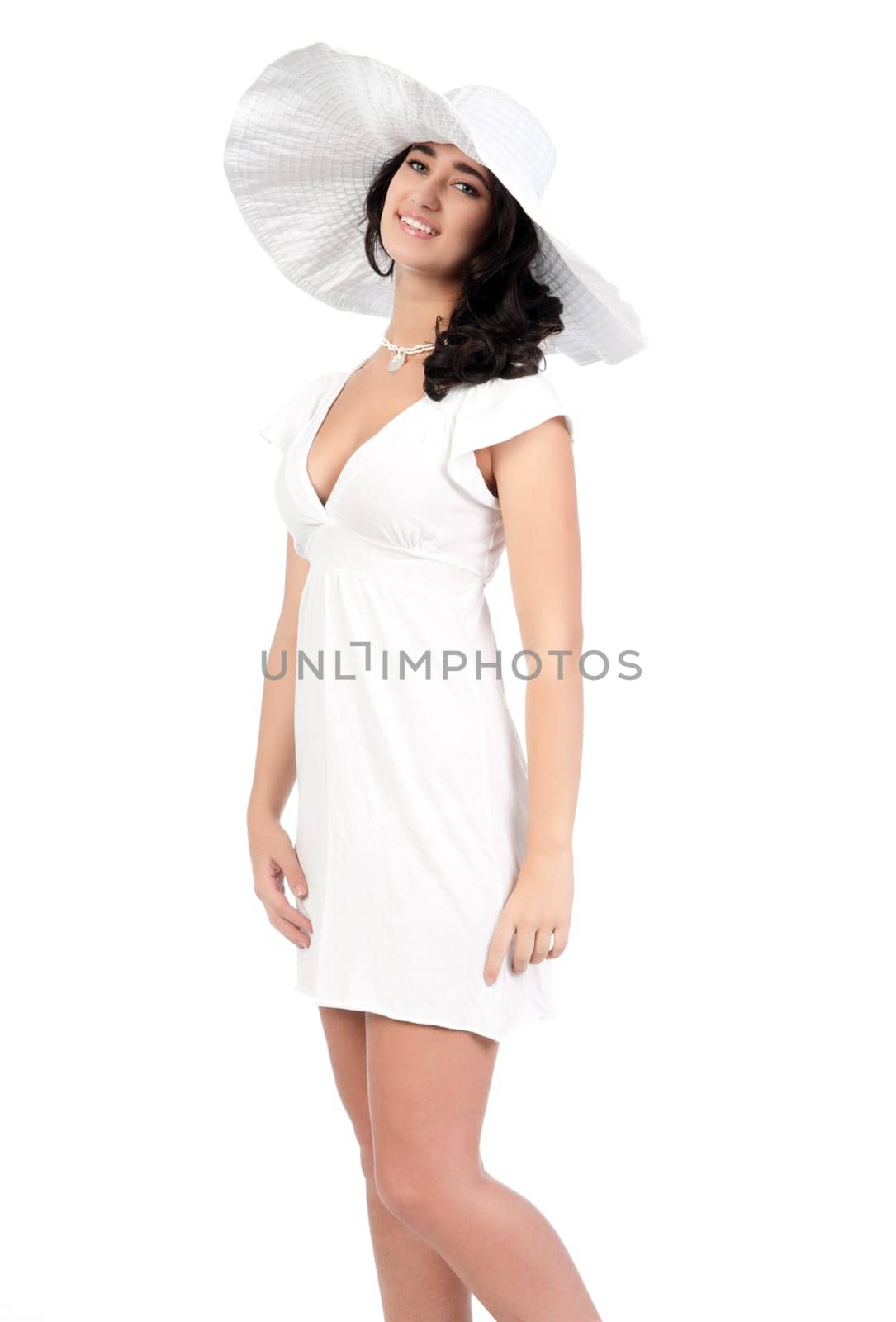 beautiful young fashion woman in white dress and hat
