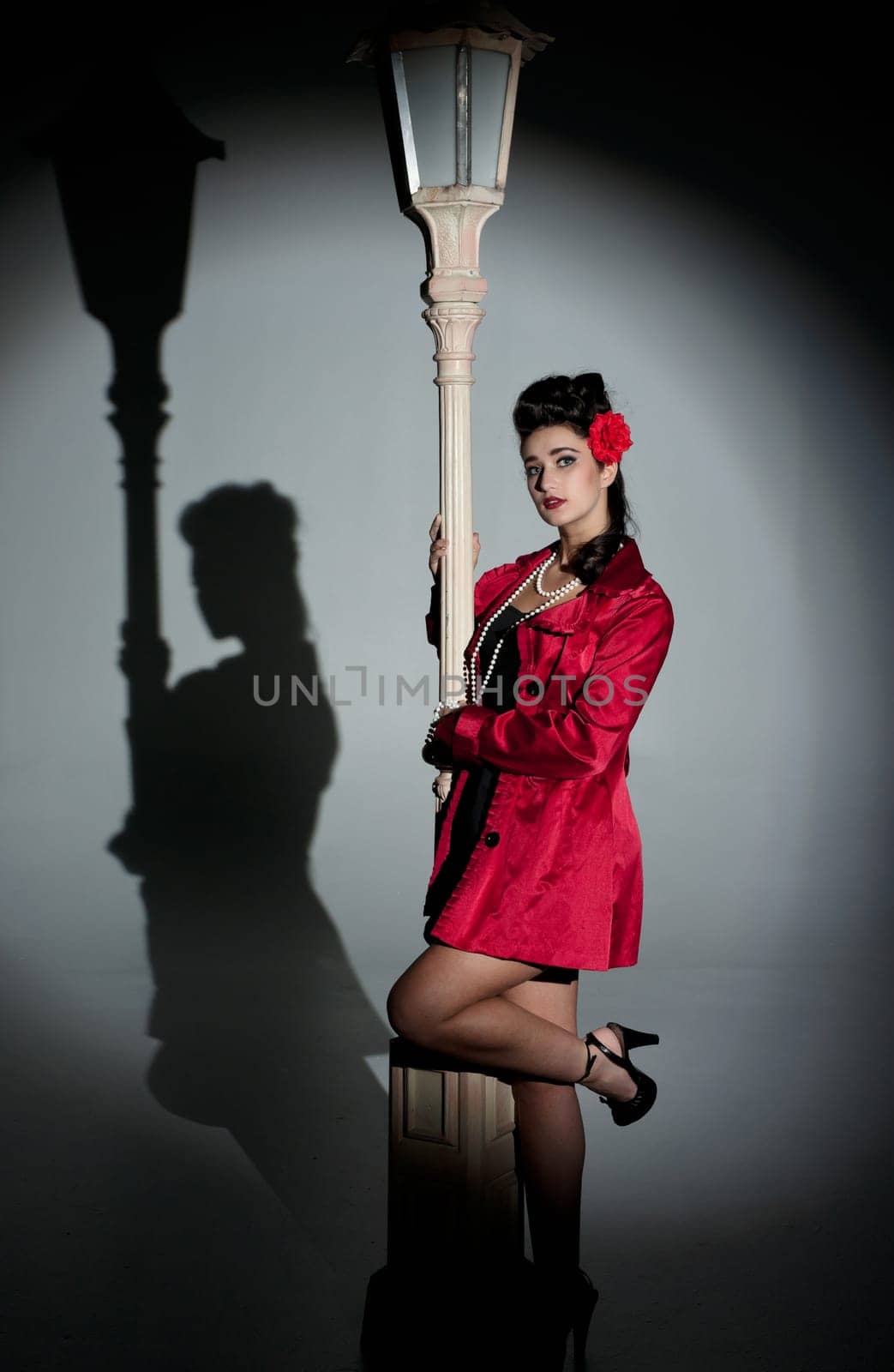 beautiful young glamorous woman  with lightpole