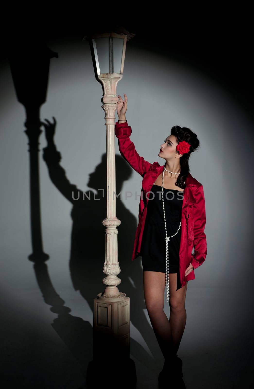 beautiful young glamorous woman  with lightpole
