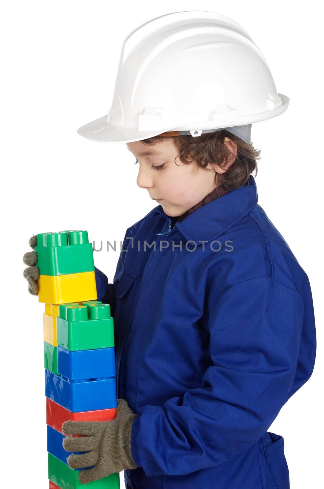 adorable future builder constructing a brick wall with toy pieces a over white background
