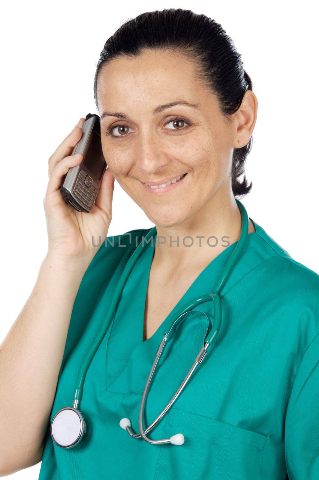 Attractive lady doctor speaking on the telephone over a white background