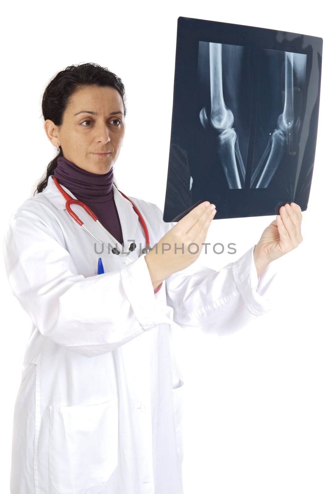 doctor examining a radio graphs a over white background