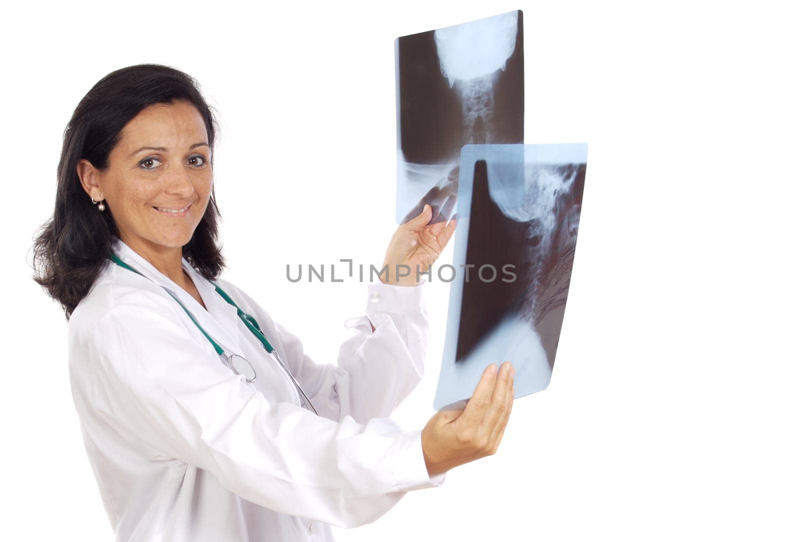 Female doctor looking to x-ray picture over white background