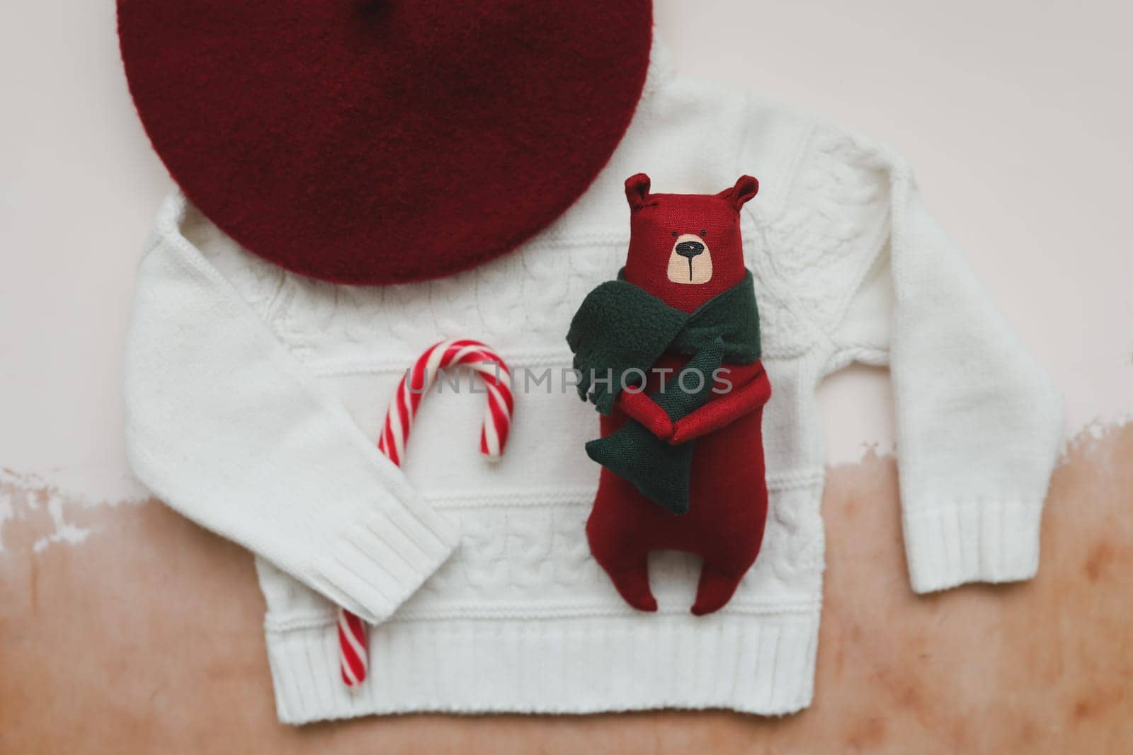 Christmas composition. Toy Teddy Bear, a gift, fir tree branches and decorations. Christmas, winter, new year concept. Flat lay, top view, copy space.