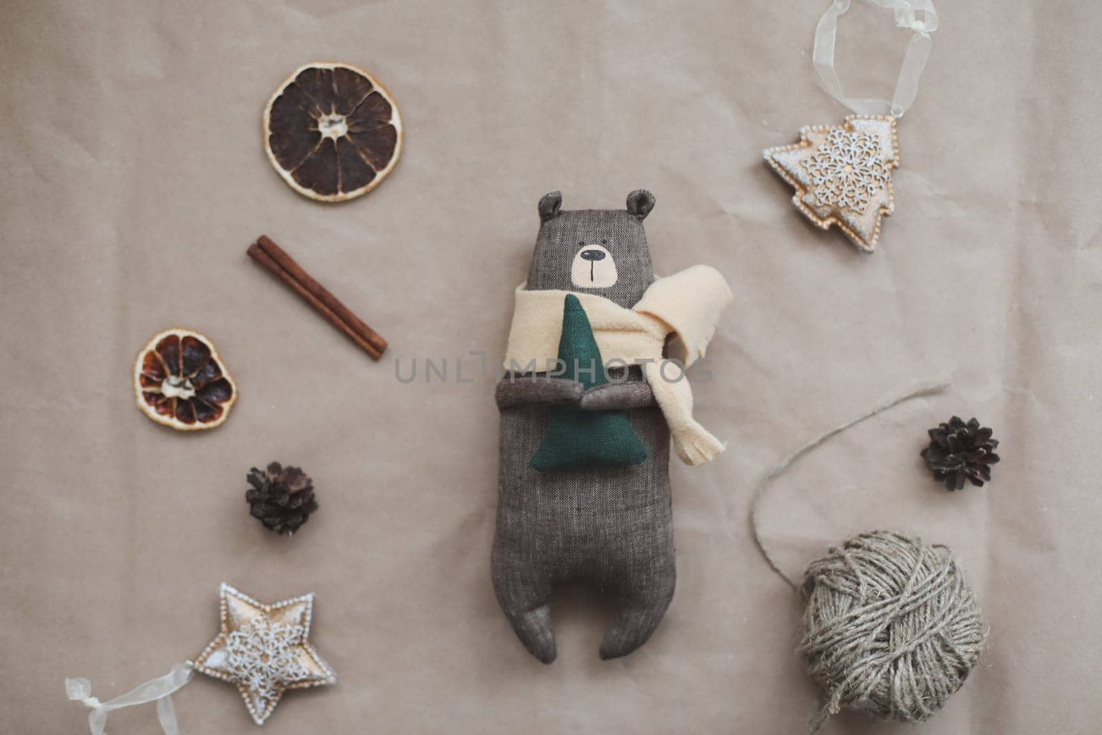 Christmas composition. Toy Teddy Bear, a gift, fir tree branches and decorations. Christmas, winter, new year concept. Flat lay, top view, copy space.