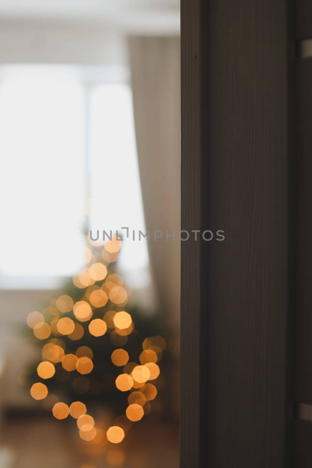 christmas background with christmas tree out of focus. abstract christmas background with defocused lights.