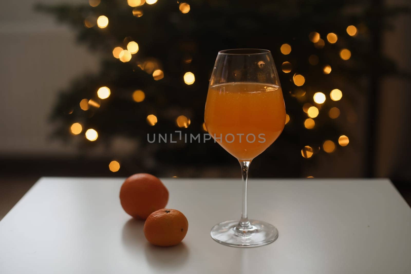 tangerine juice with tangerines on the background of the Christmas. High quality photo