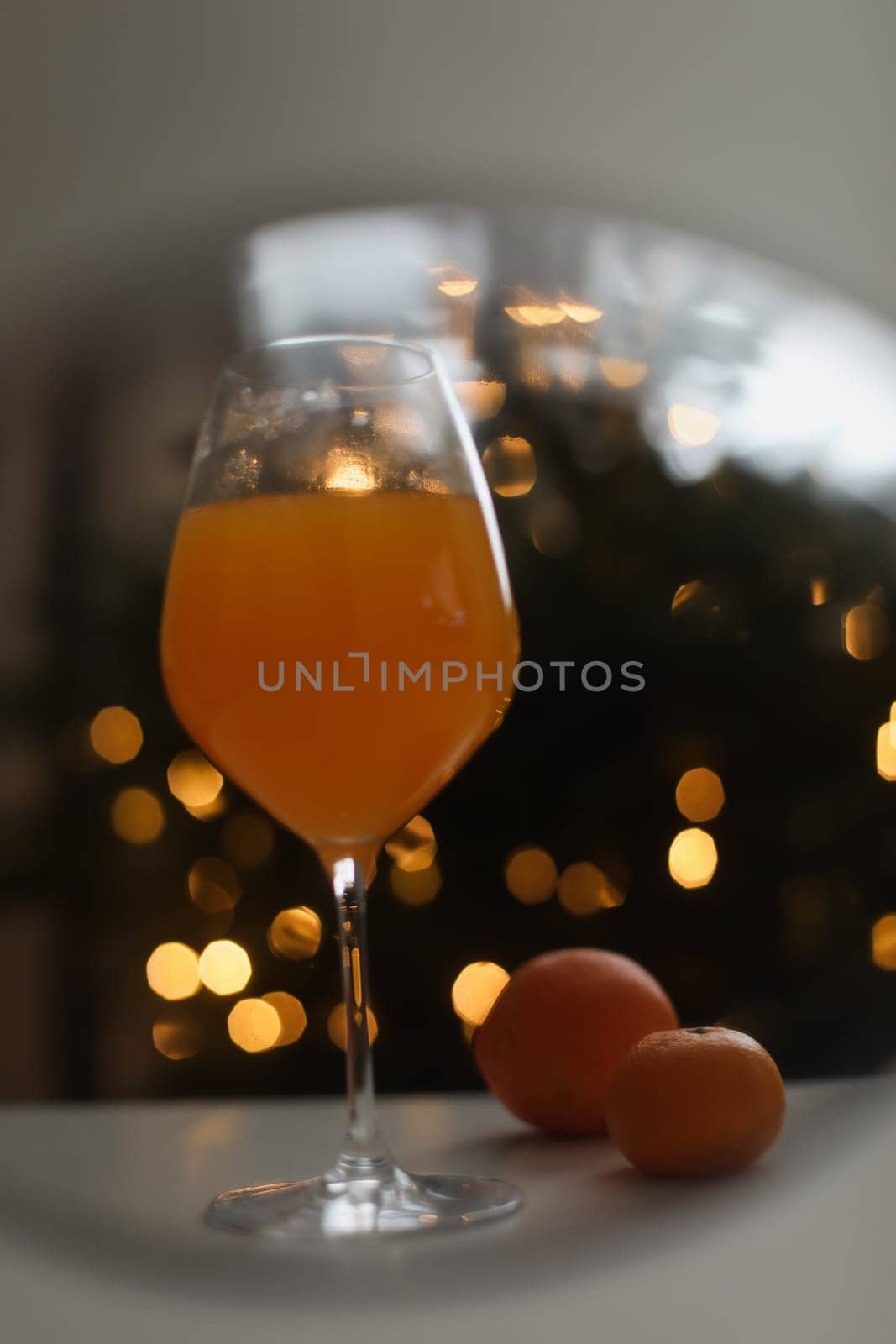 tangerine juice with tangerines on the background of the Christmas. High quality photo