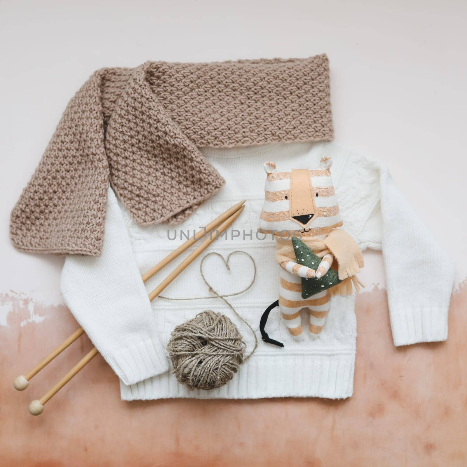 Christmas composition with a tiger toy, symbol of new 2022, a gift, fir tree branches and decorations. Christmas, winter, New year concept. Flat lay, top view.