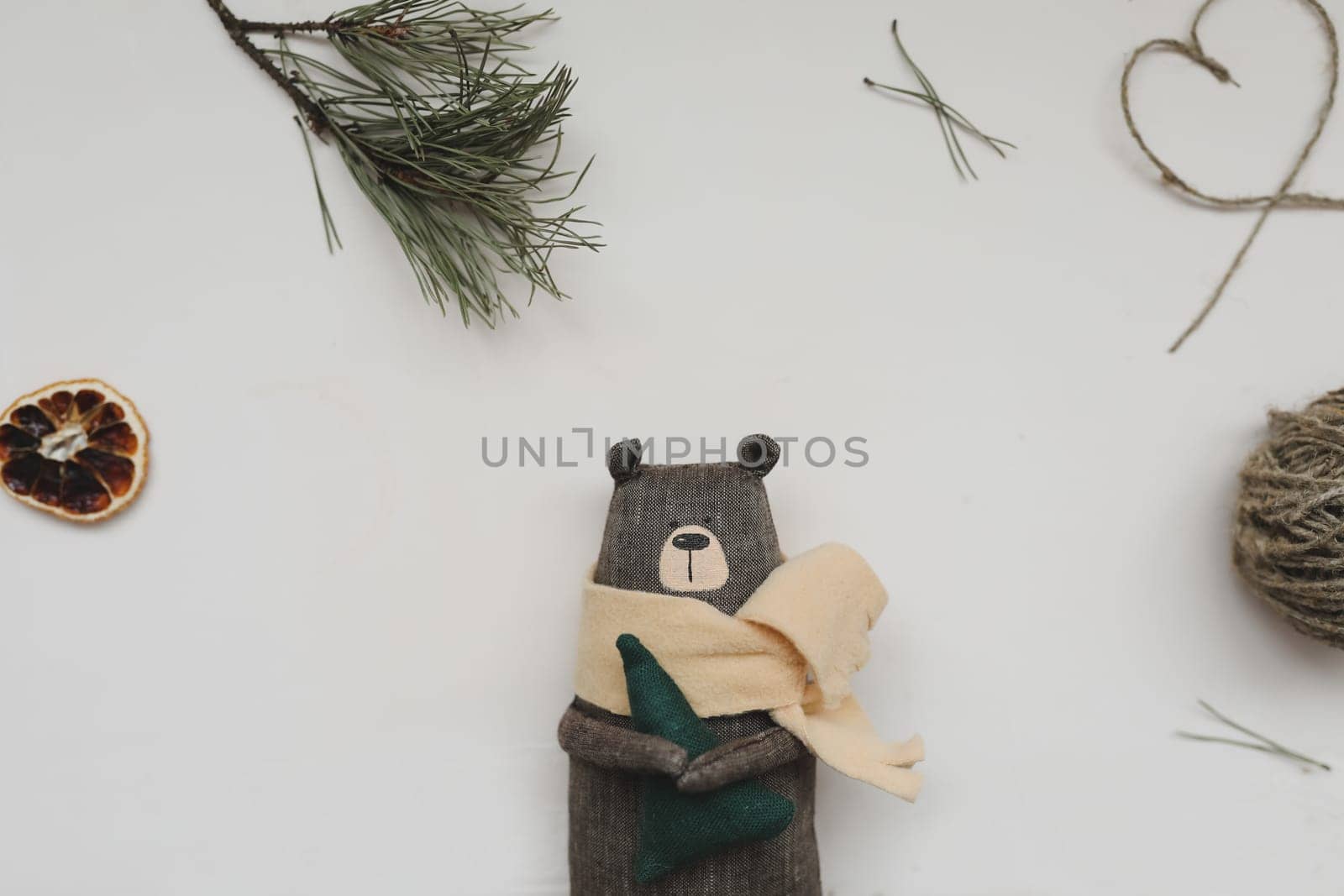 Christmas composition. Toy Teddy Bear, a gift, fir tree branches and decorations. Christmas, winter, new year concept. Flat lay, top view, copy space.