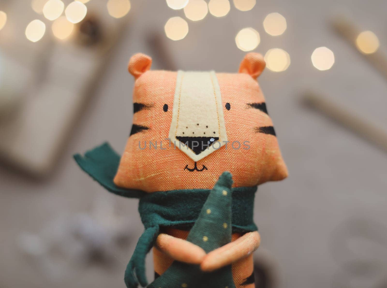 Christmas composition with a tiger toy, symbol of new 2022, a gift and decorations. Christmas, winter, new year concept. Flat lay, top view. High quality photo