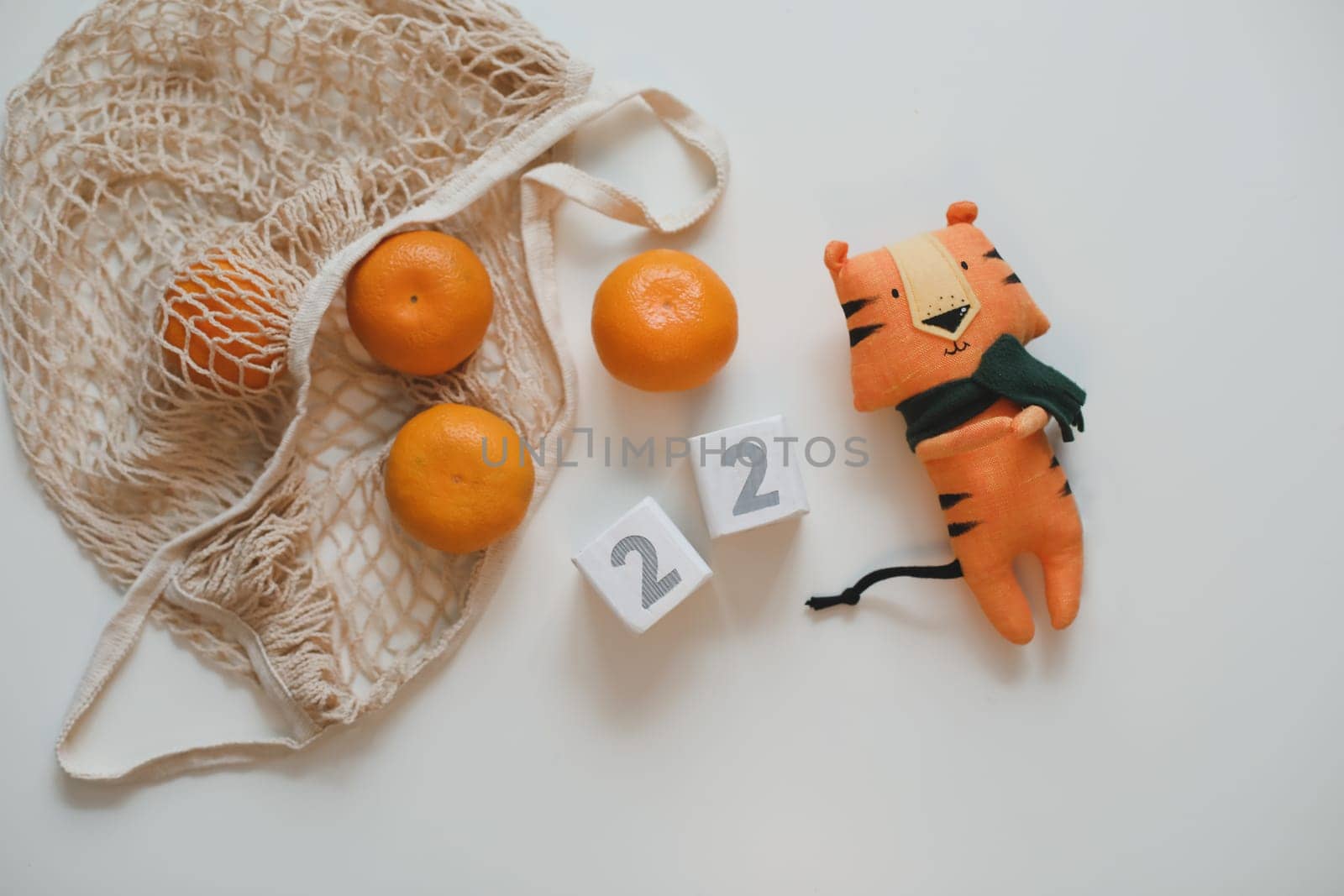 Christmas or New Year composition with tangerines and tiger toy - symbol of 2022.